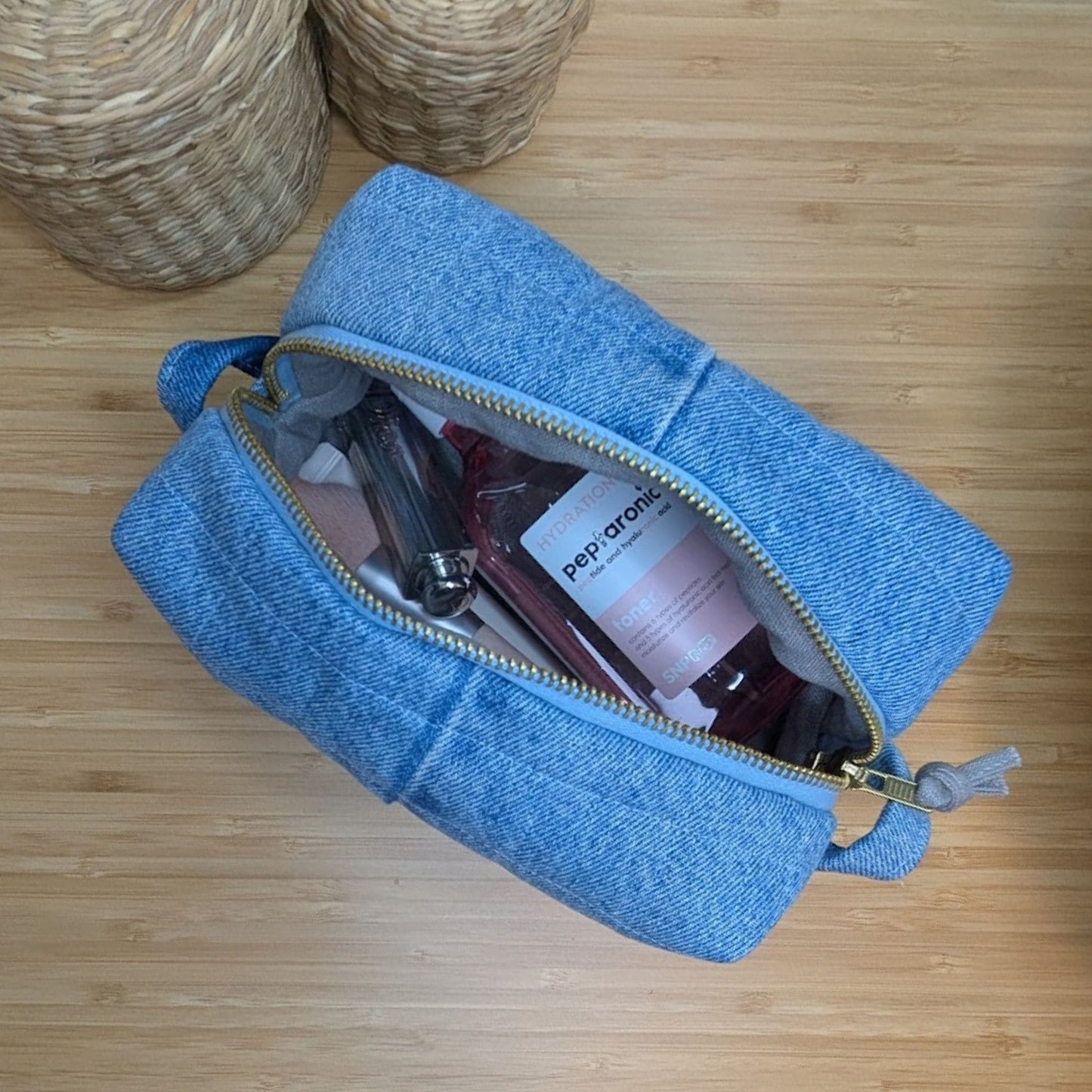 Large light blue cosmetic bag made from upcycled jeans
