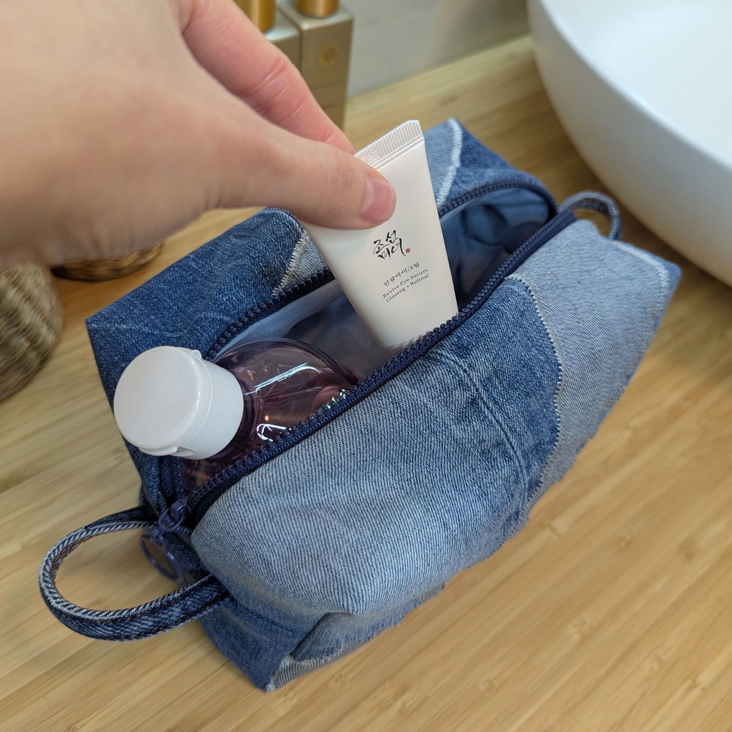 Large blue cosmetic bag made from upcycled jeans